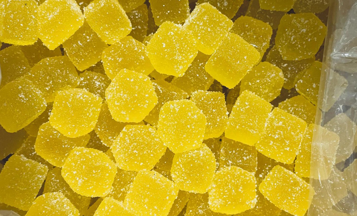 Naturally colored yellow gummies without artificial dyes, featured in a Private Label USA blog article on clean-label ingredients